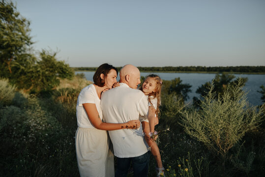 family on a walk outside the city