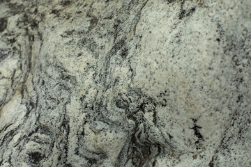 The texture of the stone. The surface of the rock is in detail. Beautiful background natural rock.