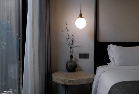 Closeup of the bedside area of a minimalist bedroom