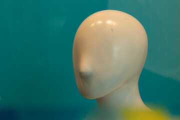 The face of the mannequin without details. Plastic head to show clothes. Mannequin with nose.