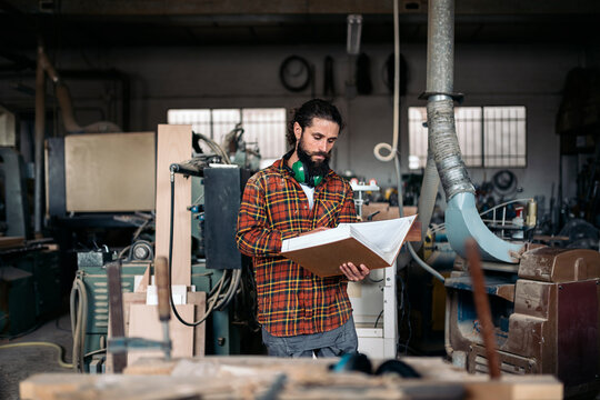 Bearded Man Working in Workshop