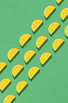 Tiled seamless pattern of papercraft layers lemon slices in modern style