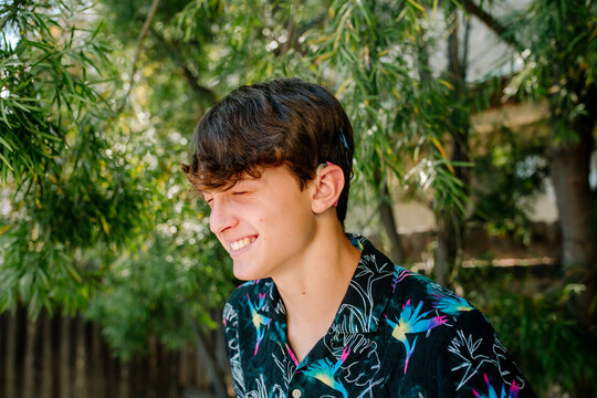 Laughing teen with Cochlear implants