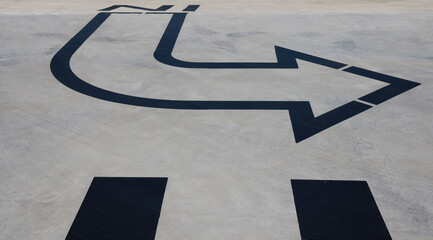 arrow on concrete floor