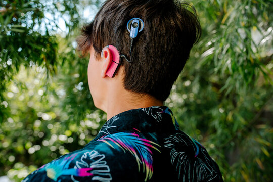 Close up of teenager with Cochlear implants