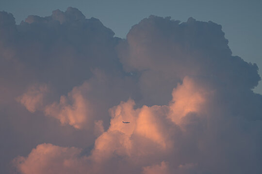 Airplane in huge clouds