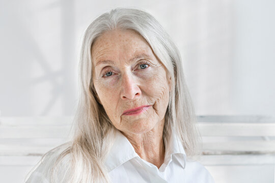 Portrait of a senior woman with grey hair.