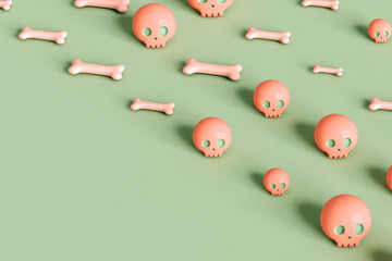 pink skulls and bone on green background