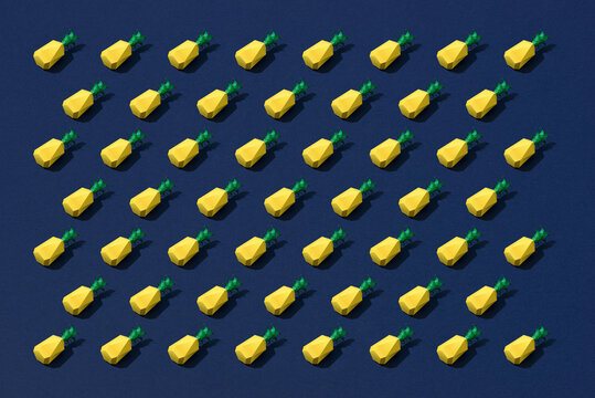 Several pineapples on a blue background