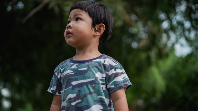 Child in the green garden