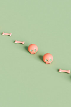 pink skulls and bone crossing the frame