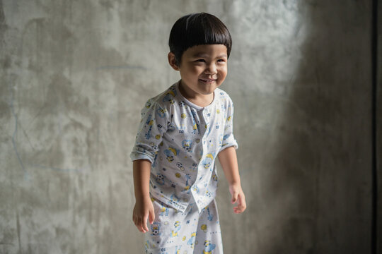 Portrait of boy in bedroom