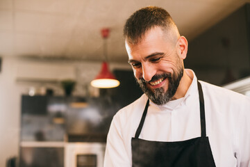 Smiling chef in kitchen 