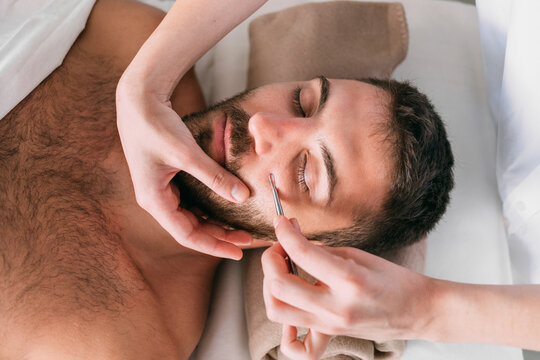 Man at Beautician on Facial Treatment 
