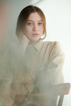 Woman behind abstract blur