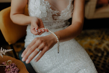 Bride wearing a pearl bracelet on her wrist