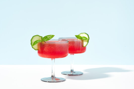 Watermelon Cocktail with Basil and Cucumber Garnish 