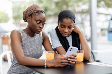 Two friends looking bad news