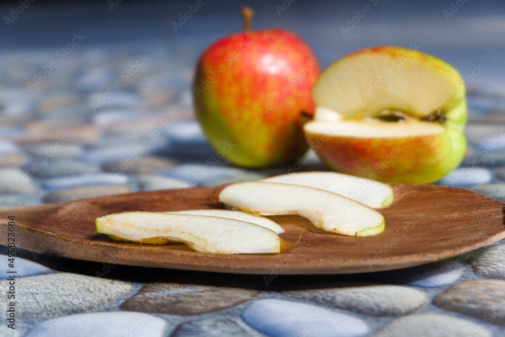 Aufkleber closeup shot of colorful apples in various styles with a stone background