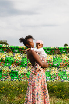Portrait of young mother and son outdoors