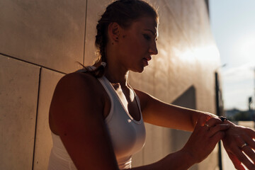 Woman interacting with a Sport Watch