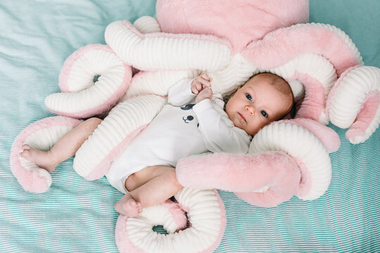 Baby and a and pink octopus