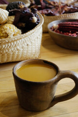 Cup of Atole, a traditional Mexican beverage made of hot corn and masa, is served in Mexico City, Mexico. Selective focus.