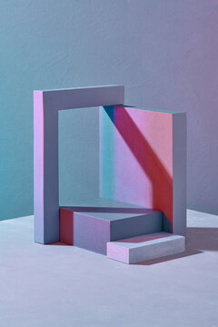 Product stand with cubes and a frame shaded by small columns.