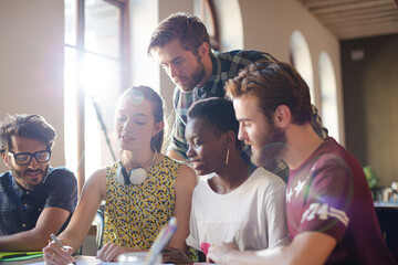 Creative business people brainstorming and working in office