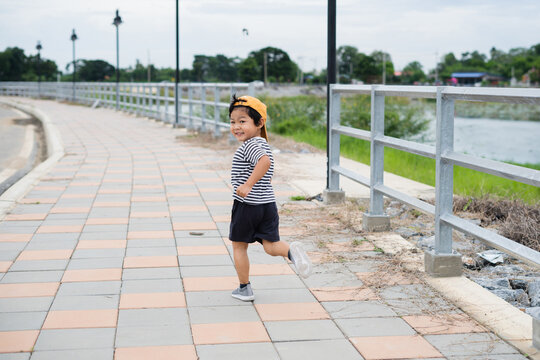 Boy run on sidewalk