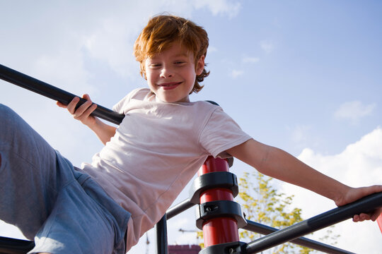 Happy  boy playing on playground