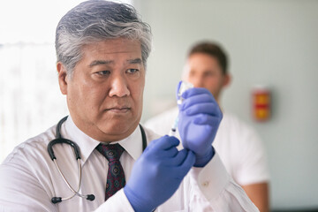 Exam: Doctor Administering Vaccine To Male