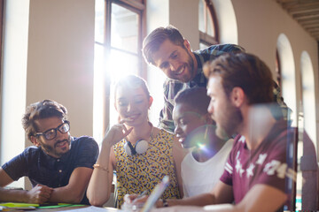 Creative business people brainstorming and working in office