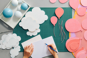 Sketching and making paper cutouts for the craft artwork project