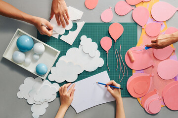 Making paper cutouts, decorative items and tools on the foreground