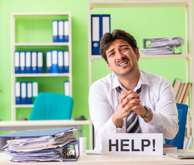 Sick and unhappy businessman sitting in the office