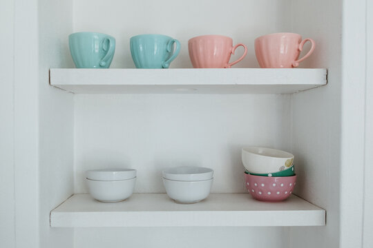 Kitchen cupboard with cups ans bowls