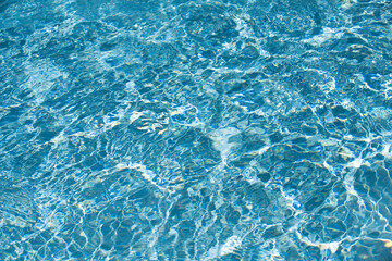 Pool water background, blue wave abstract or rippled water texture background.