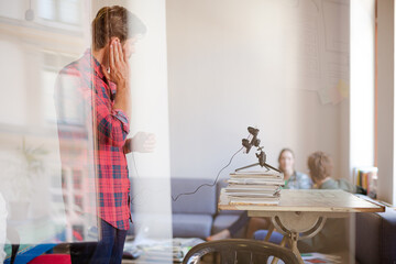 Creative businessman posing photograph for coworker instant camera in office