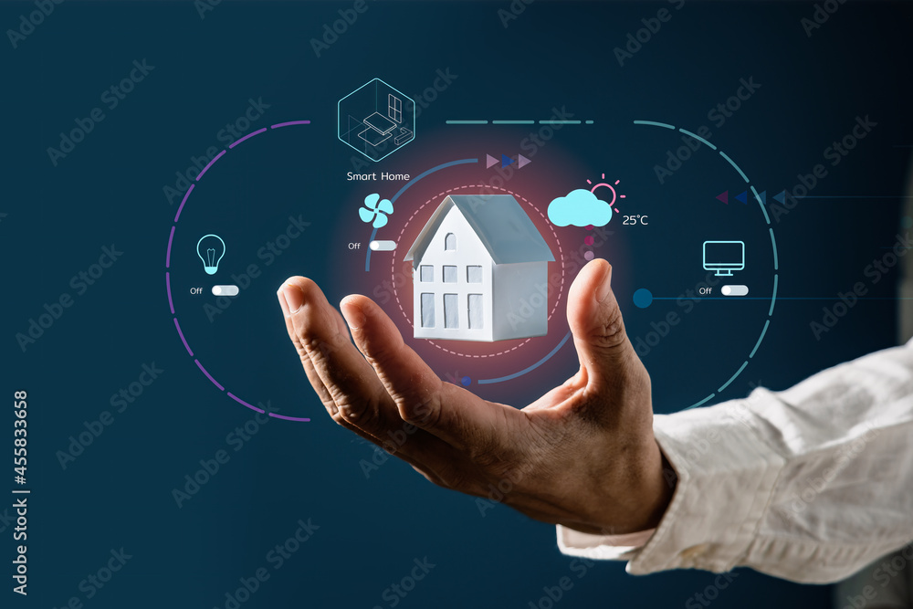 Aufkleber businessman holding a house model with virtual screen of smart home automation application. smart ho