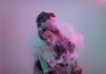 Cinematic hug portrait inside smoke cloud