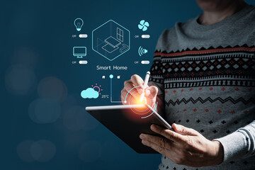 Man using computer tablet with virtual screen of smart home automation application. Smart home controlling and Automation system technology of things