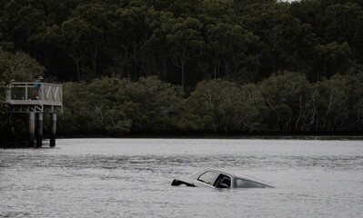 Car sinking in the water