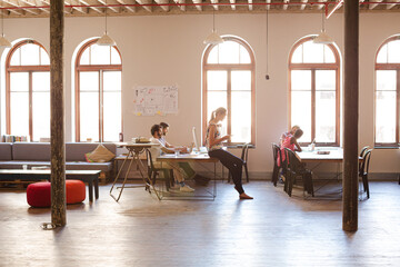 Casual business people talking in meeting in office