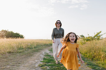 Happy girl with mother running