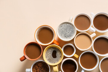 Cups of tasty coffee on light background