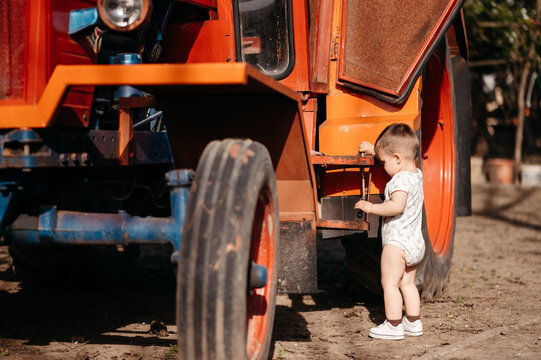 Boy exploring tractor