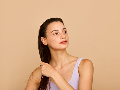 woman combing hair in studio