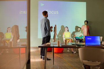 Business people preparing audio visual presentation on Focus