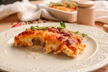 Plate with piece of delicious casserole with minced meat, closeup